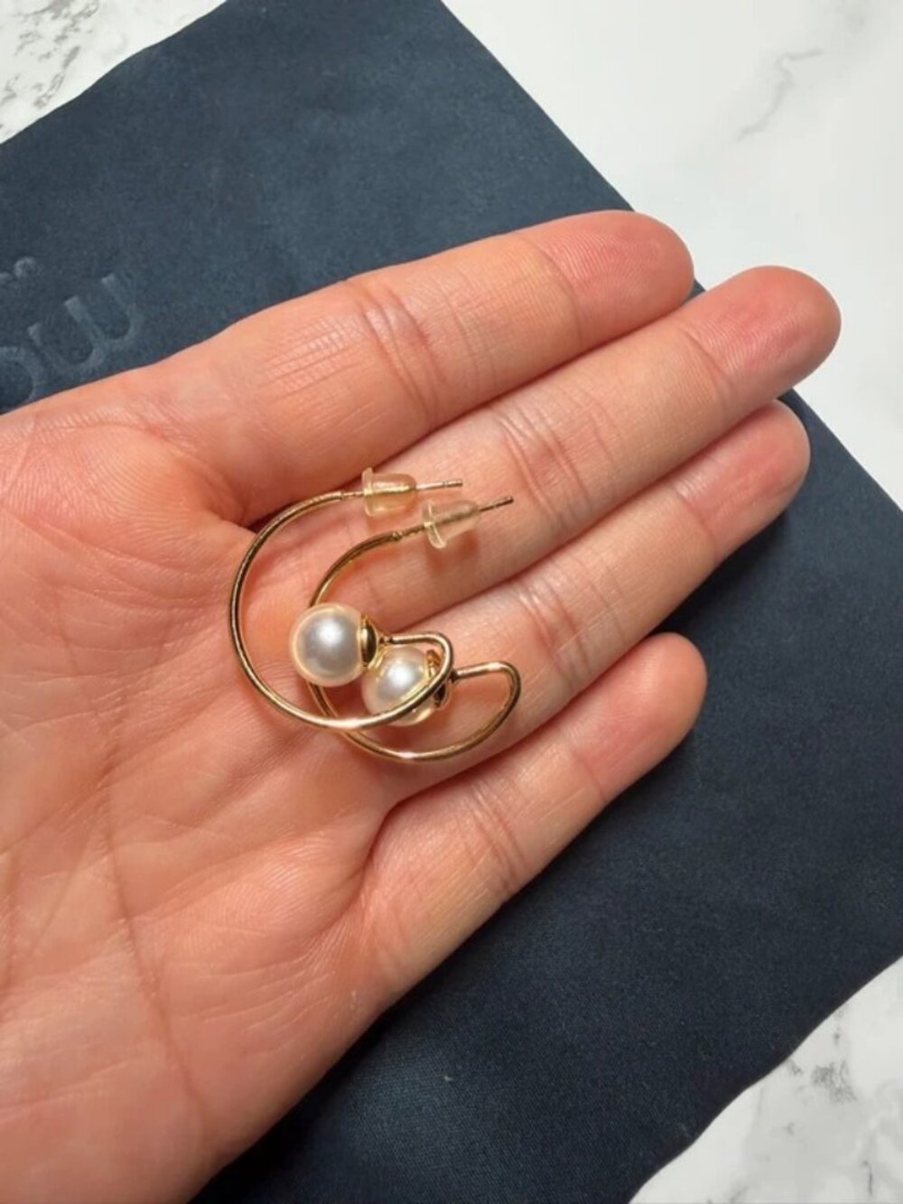 Gold hoop earrings with pearl open circle studs